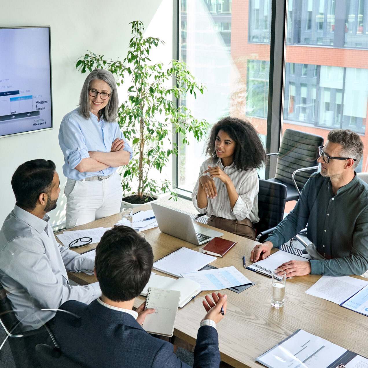 Diverse Corporate Team Working Together In Modern Meeting Room Office.
